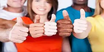 © michaeljung - stock.adobe.com | group of multiracial friends thumbs up